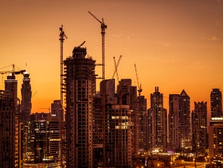 City construction site at sunset