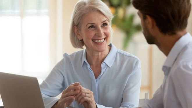 woman talking to man in a meeting
