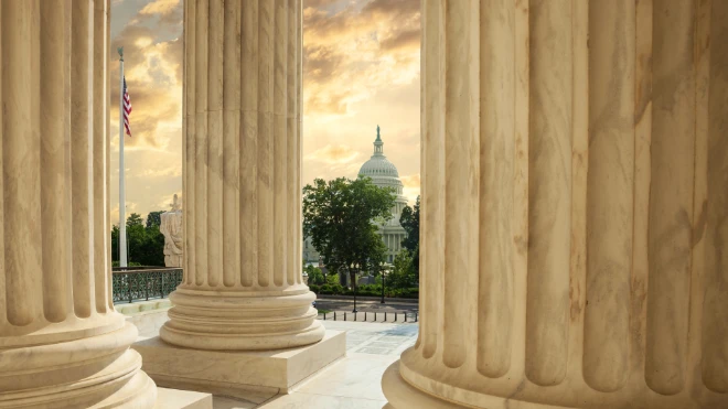 capitol building through columns of supreme court