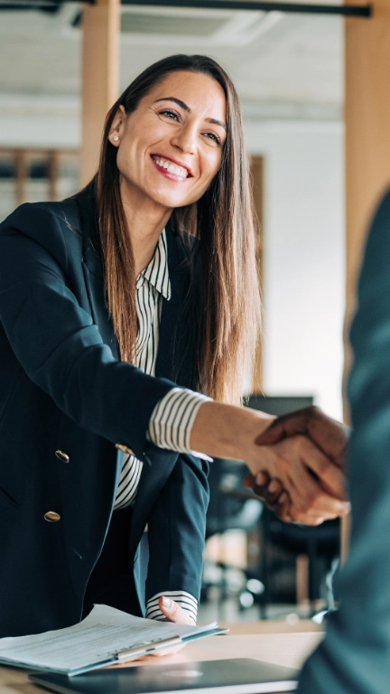 woman shakes hand of man