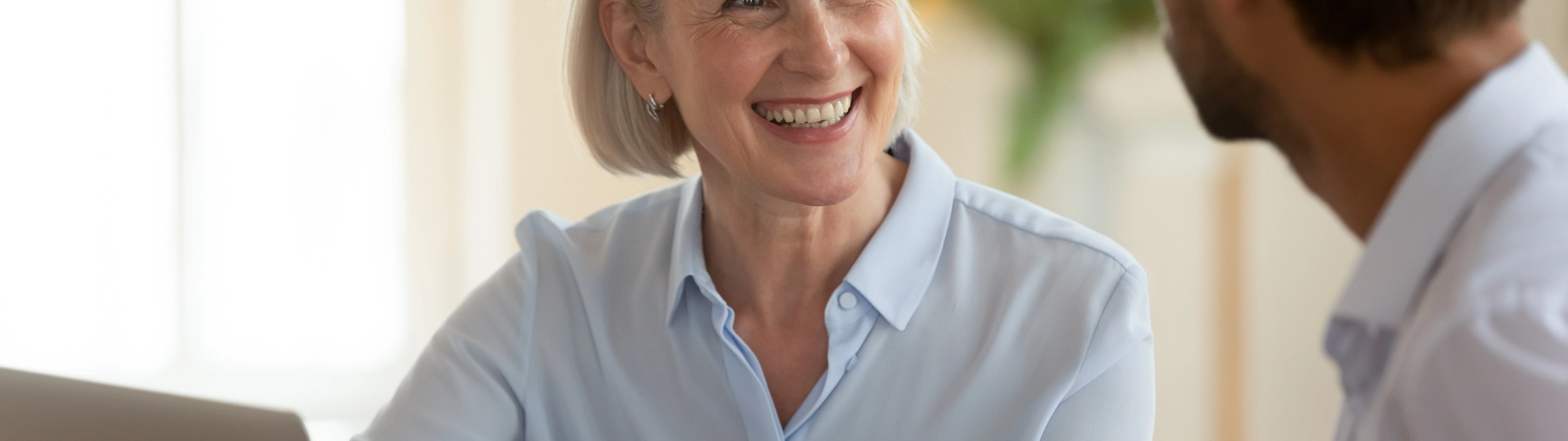 woman talking to man in a meeting