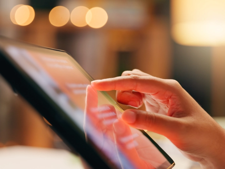 Hand touching tablet